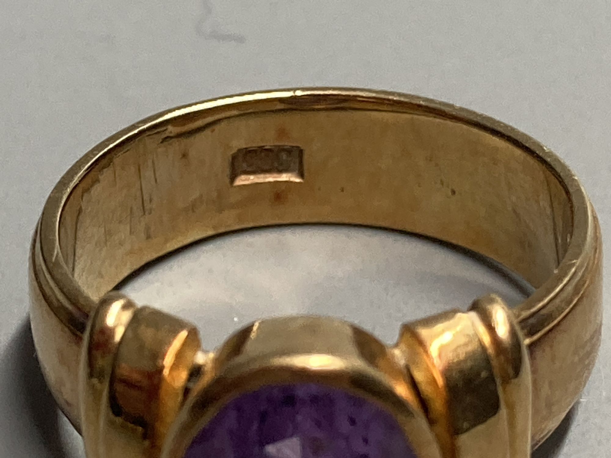 A 1950s? 585 yellow metal and amethyst set dress ring, size K, gross 7.3 grams.